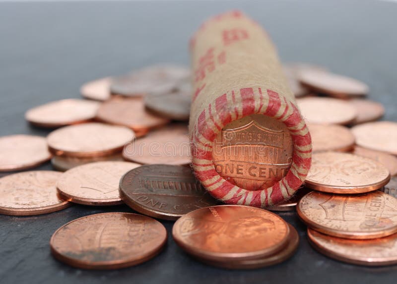 Roll of Pennies on Top of Loose Pennies. Stock Image Image of