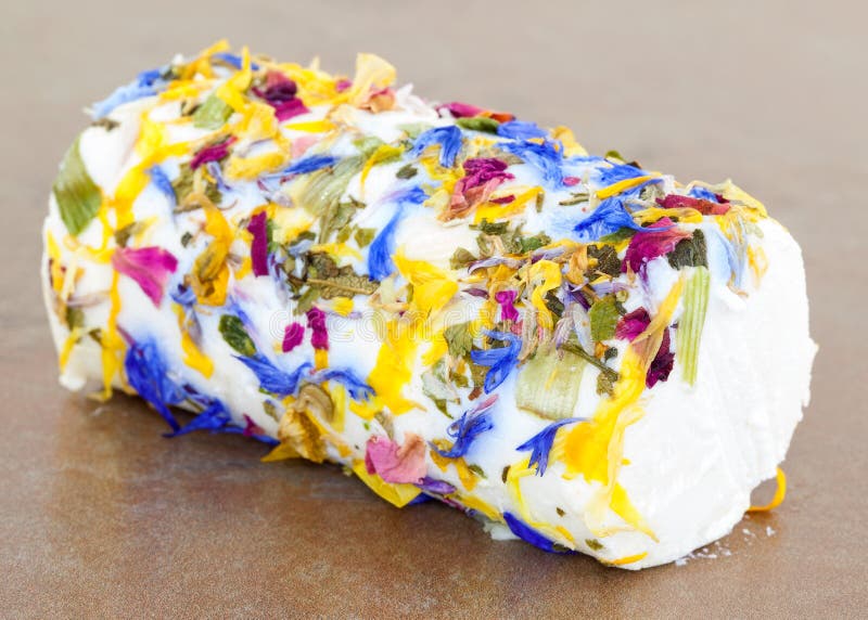 roll soft bouchette dairy cheese covered honey flowers tile surface soft white cheese covered edible flowers 145950564
