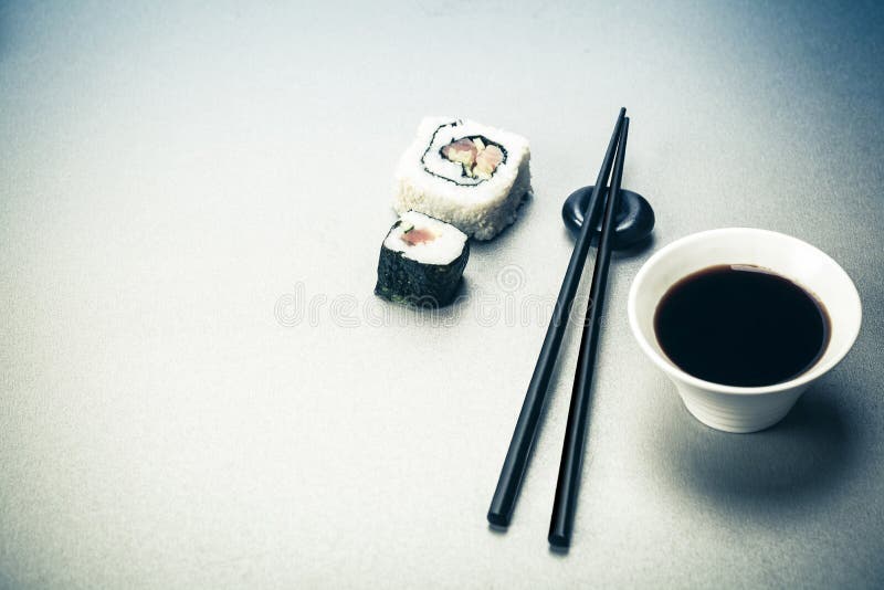 Roll, soy sauce and chopsticks