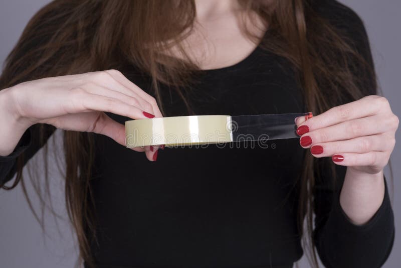 Roll of Sticky Tape with Hands of a Woman Stock Photo Image of office
