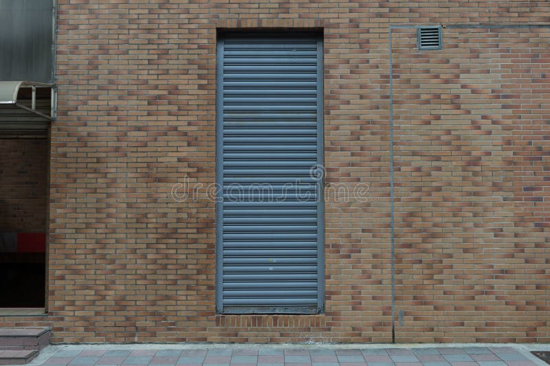 Roll Up Garage Door on Brick Wall Stock Photo Image of stained, color