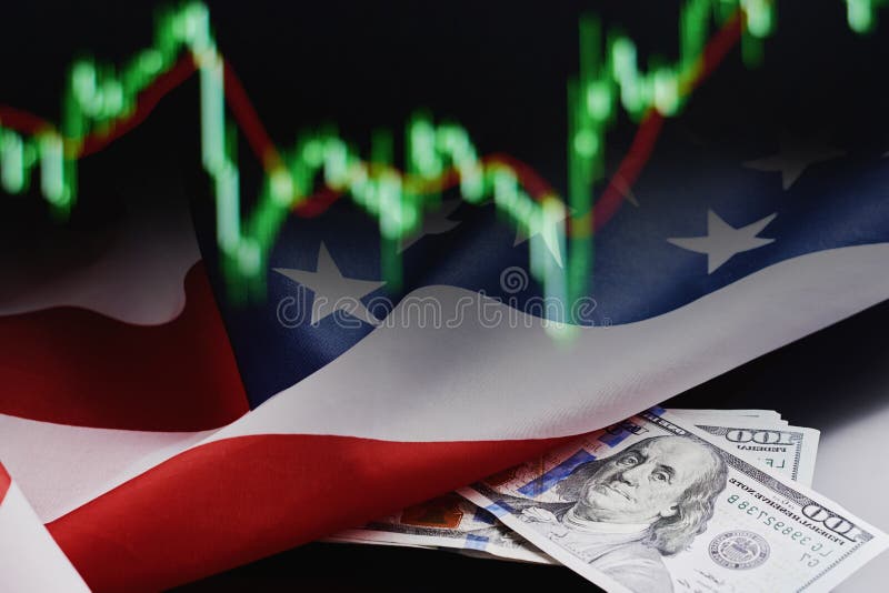Financial crisis in the global economy concept. Stock market currency quotes, american flag and dollar bills on a dark background. Financial crisis in the global economy concept. Stock market currency quotes, american flag and dollar bills on a dark background