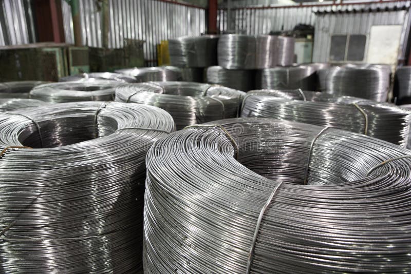 Rolled Metal Wire in Reels is Stored in a Warehouse in Packages Stock