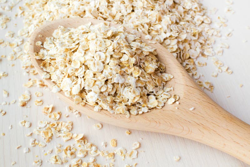 Rolled oats in a big spoon stock photo. Image of vegetarian - 161343848