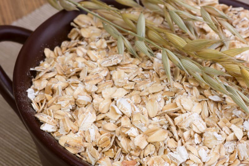 Rolled oats and oat stalks stock photo. Image of heap - 59217550