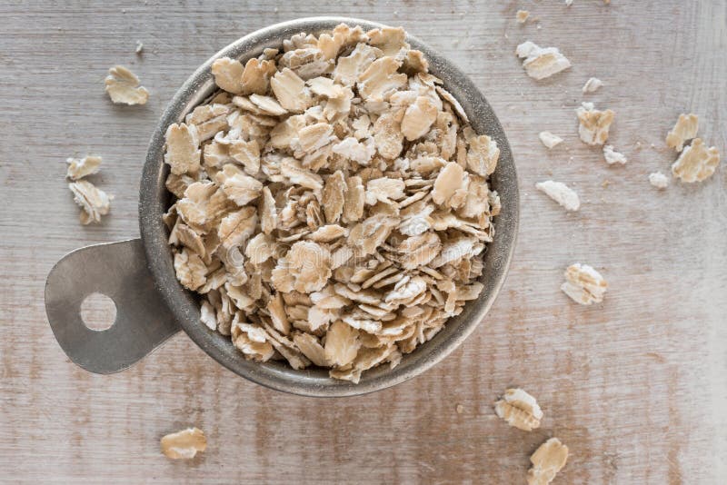Raw Oats in a Measuring Cup Stock Image - Image of oatmeal, counter ...