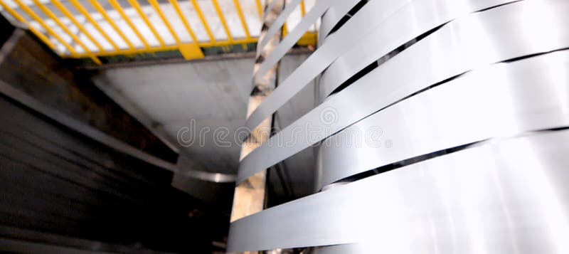 Rolled steel. Stack of rolls, cold rolled steel coils in action. Galvanized steel sheet and rusted edge. Cold rolled steel coils. Drum turns sheets into production. Industrial. Metal steel drum stock images, royalty-free photos and pictures
