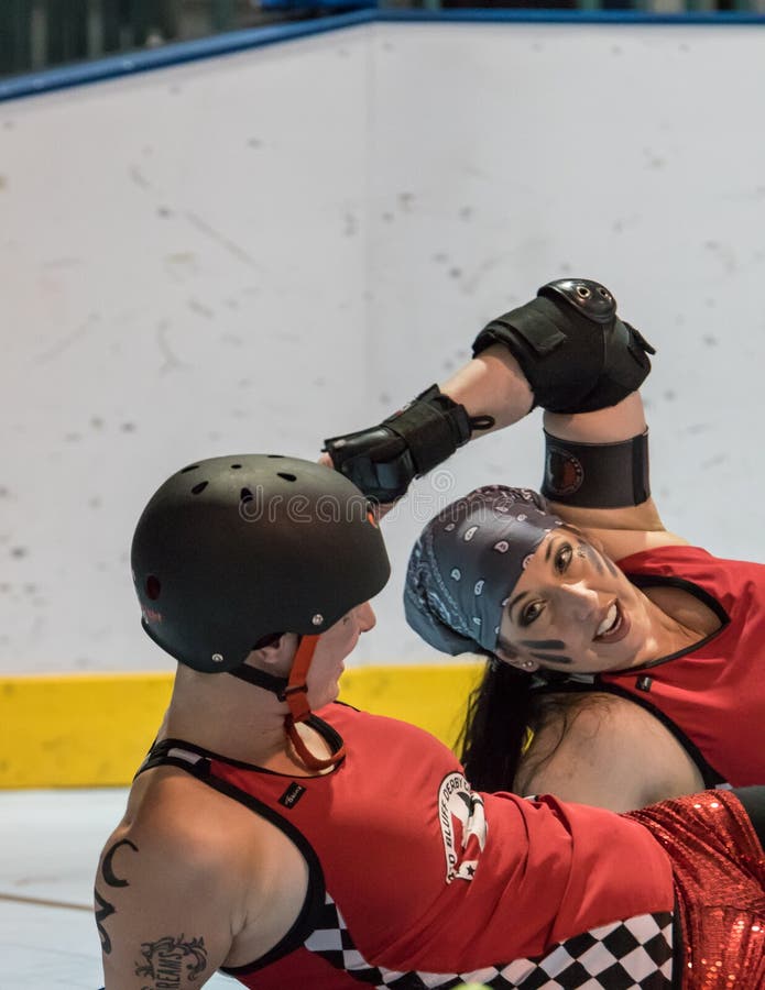 Redding, California: Two skaters from the Red Bluff Derby girls team stretch out on the track before a bout against Shasta Roller Derby. Redding, California: Two skaters from the Red Bluff Derby girls team stretch out on the track before a bout against Shasta Roller Derby.