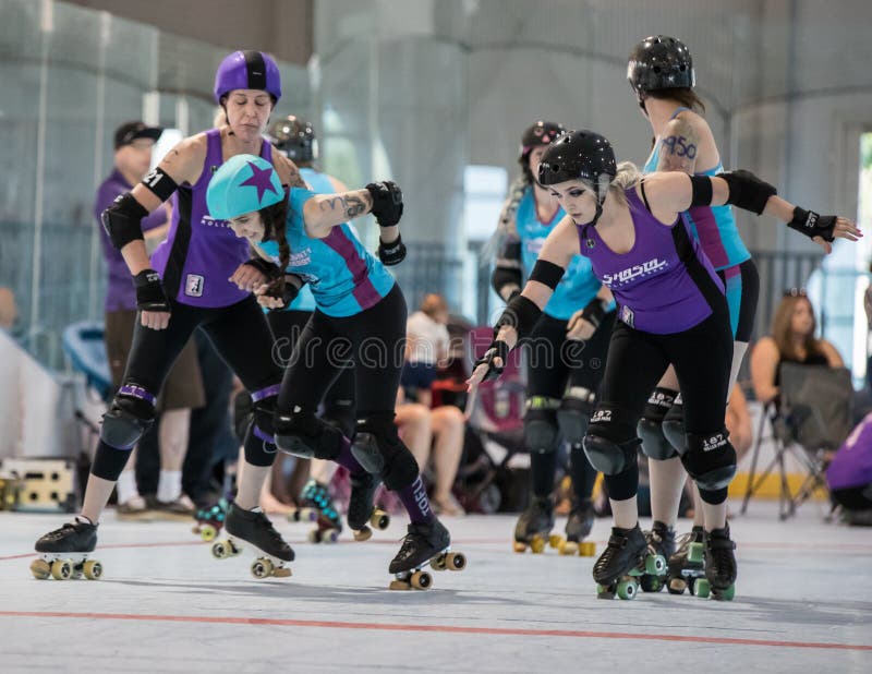 Roller derby skaters take position in a match with Shasta vs. Sonoma at Redding, California. Roller derby skaters take position in a match with Shasta vs. Sonoma at Redding, California.