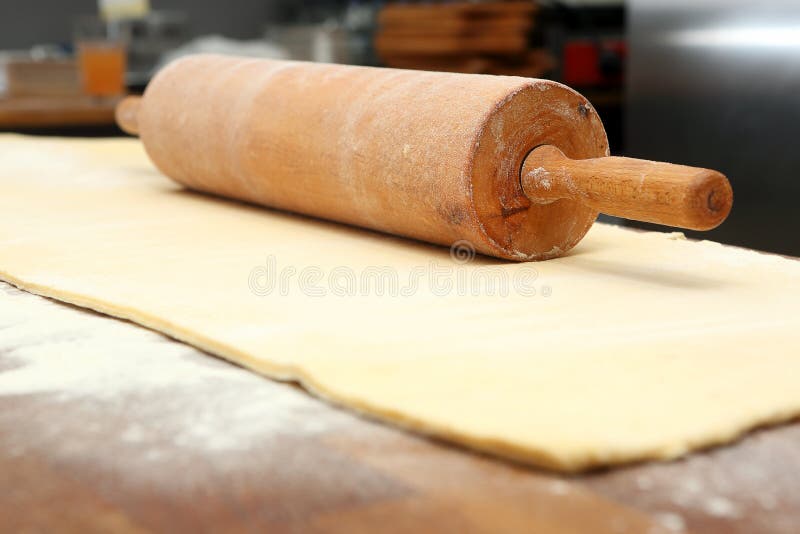 Roller and Dough into the Kitchen Table Ready for Rolling Stock Image