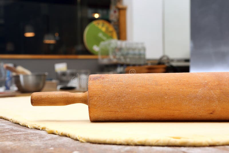 Roller and Dough into the Kitchen Table Ready for Rolling Stock Image