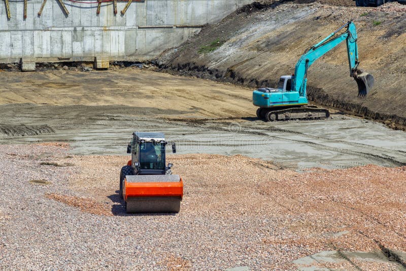Roller leveling the ground of the foundation royalty free stock images