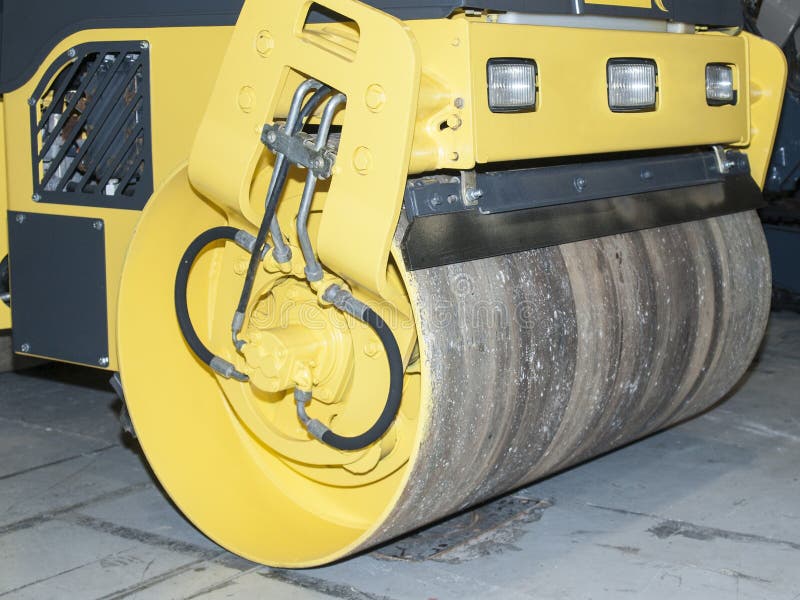 One Asphalt Tamping Roller Works In A Public Park On A Sunny Spring Day