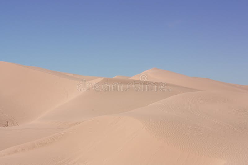 Rolling desert sand dunes