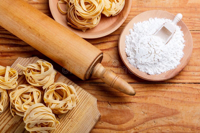 Rolling pin and pasta stock photo. Image of table, tasty 45904396
