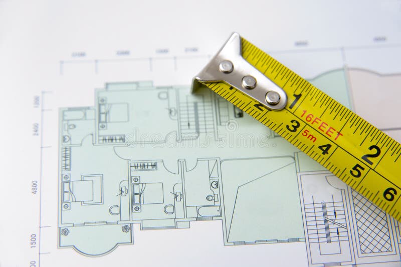 Rolls Of Architectural House Plans & Tape Measure Royalty Free Stock