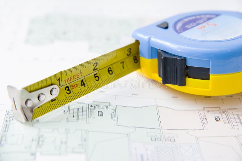 Rolls of Architectural House Plans & Tape Measure Stock Photo - Image