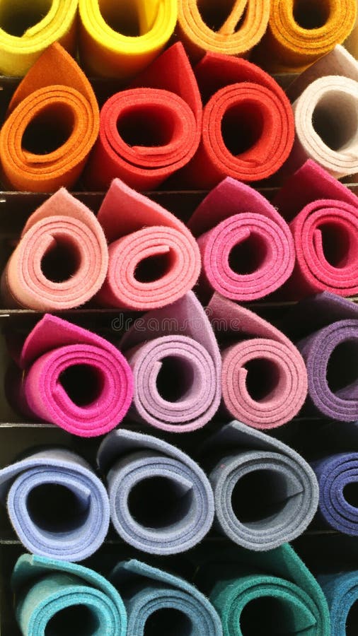 Various rolls of fabric at a bulk fabric stop Stock Photo