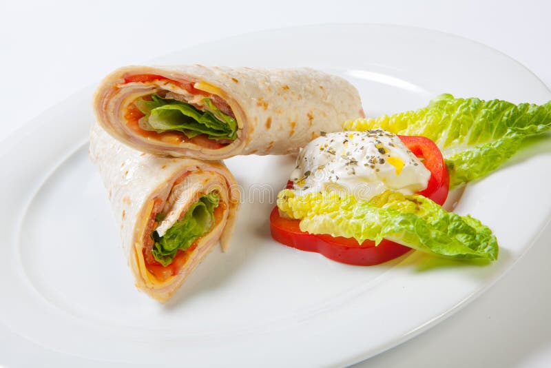 Rolls from Pita Bread Stuffed with Salad Cheese Ham and Vegetables