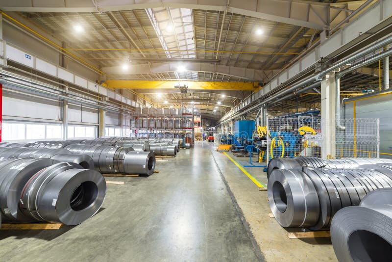 Rolls of Sheet Metal Lie on the Floor. Internal Warehouse of Raw