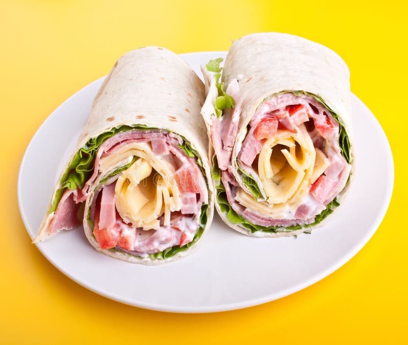 Wrapped tortilla sandwich rolls cut in half. Wrapped tortilla sandwich rolls cut in half