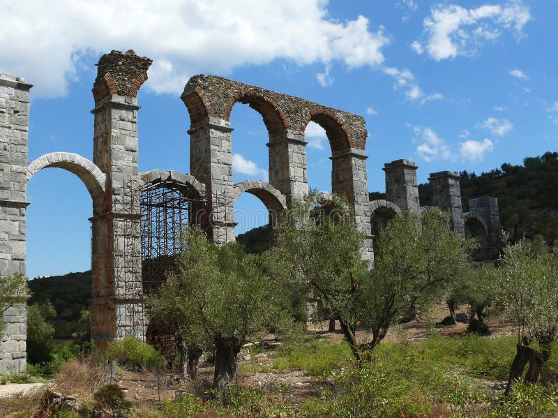 Roman aqueduct between olive trees. Lesvos. Greece stock image