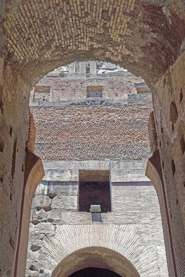 Image taken of a roman arch in the coliseum in rome, italy.