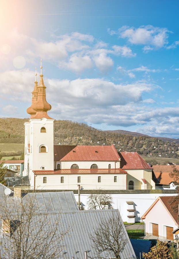 Roman catholic church in Divin village, Slovakia, sun rays