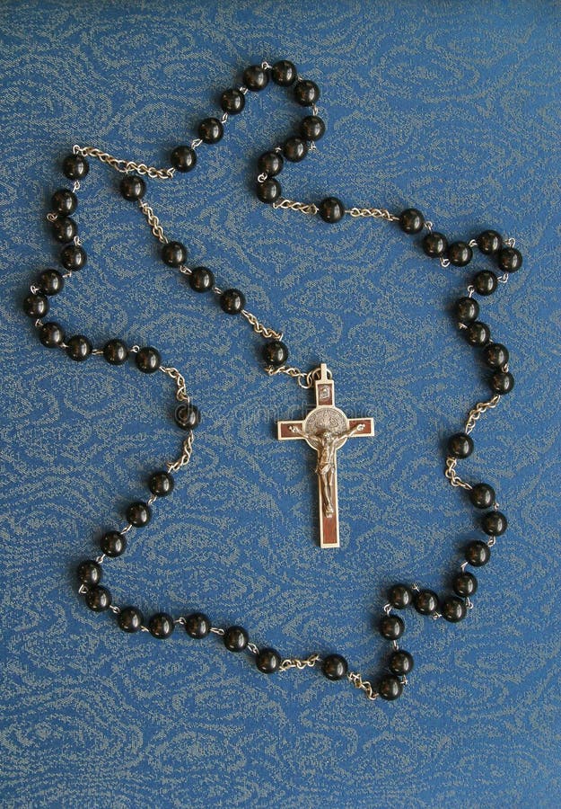 Roman Catholic Rosary on a Blue