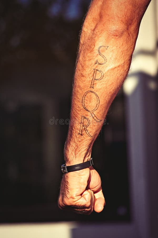 Roman gladiator tattoo. SPQR Rome. Italian man arm