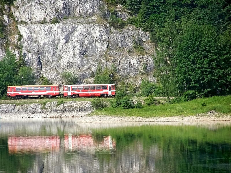 Romance and dreaming in nature train around water.