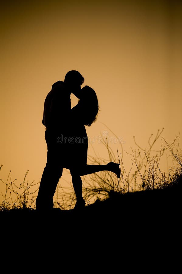 Romance at Sunrise stock image. Image of kissing, hugging 12674623