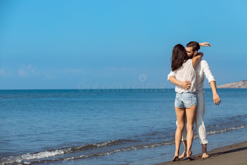 Romance on Vacation Couple in Love on the Beach Flirting Stock Photo