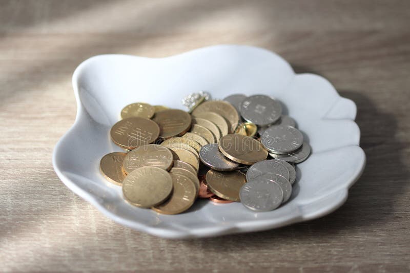 Romanian coins in a ceramic bowl. Romania currency Lei or Bani