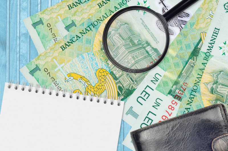 1 Romanian leu bills and magnifying glass with black purse and notepad. Concept of counterfeit money. Search for differences in