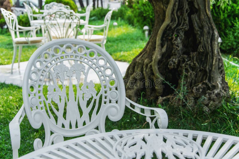 Romantic antique furniture in the garden stock photo Romantic antique furniture in the garden stock photo