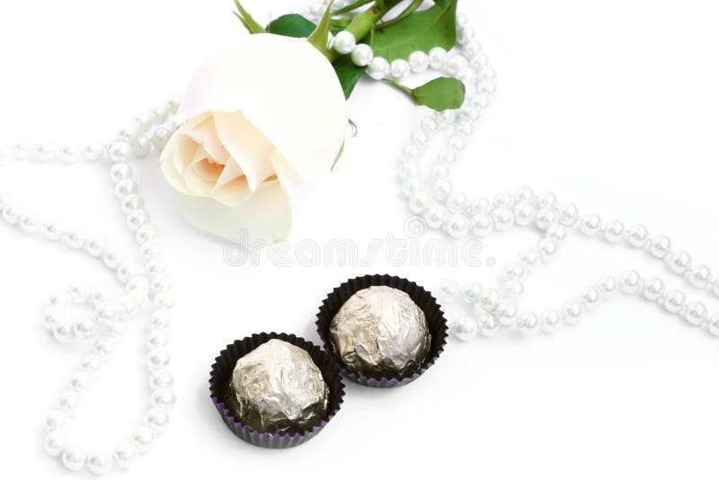 romantic background with rose, sweets and pearl