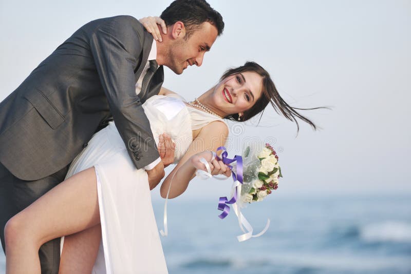 Romantic beach wedding at sunset