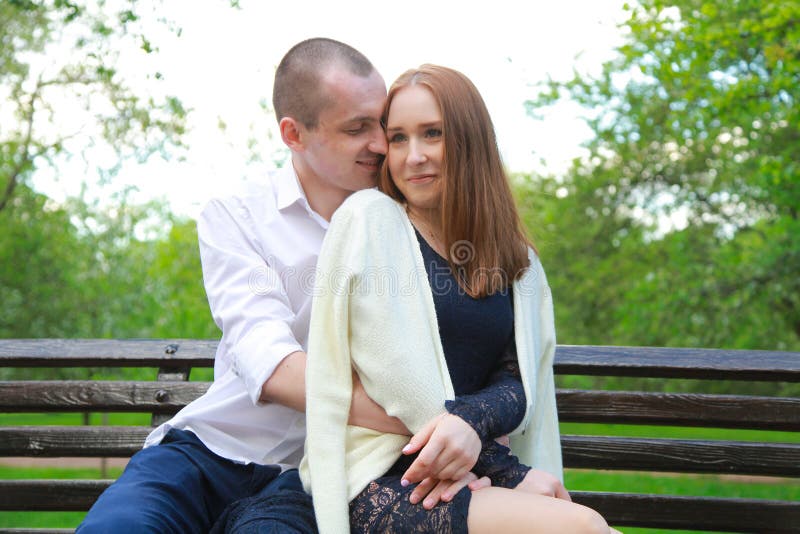 Romantic Couple on a Bench Hugs and Enjoys Together in Love Stock Image ...