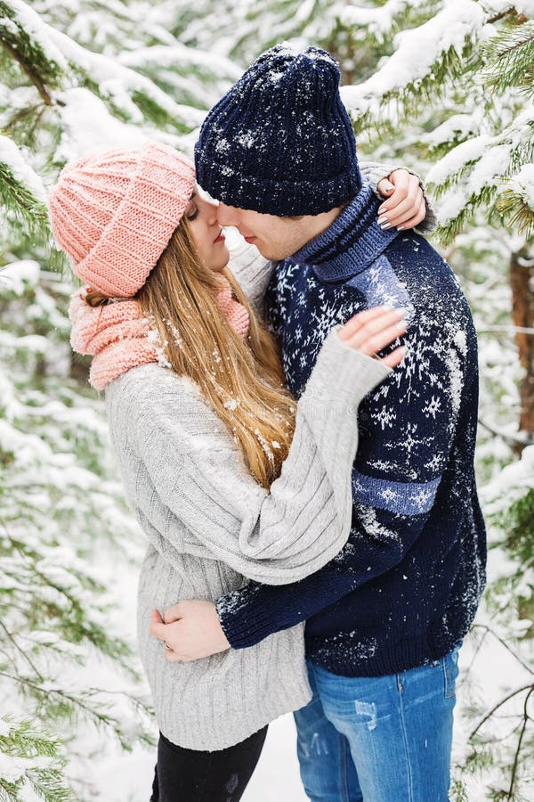 Romantic Couple Embracing In Snowy Forest Among Fir Trees Stock Image Image Of Dynamic