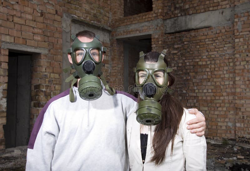 Romantic couple with gas masks