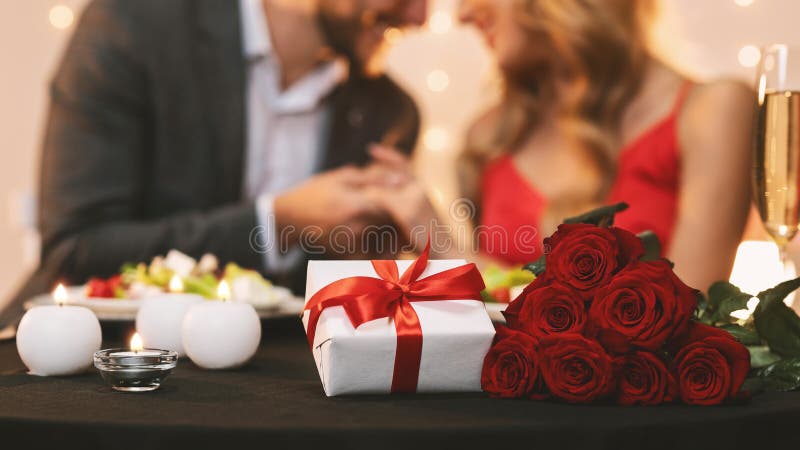 Romantic Couple Celebrating Valentine`s Day In Restaurant, Holding Hands