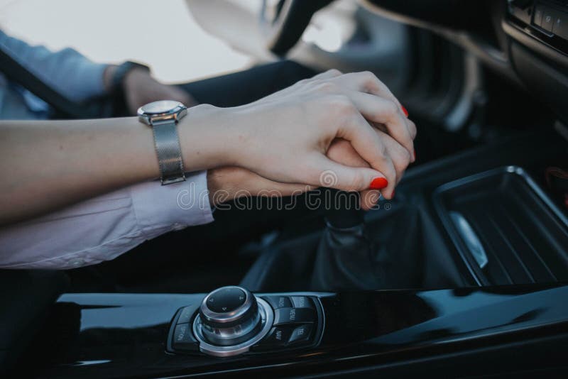 romantic-couple-holding-hands-gear-shift-driving-car-romantic-couple-holding-hands-gear-shift-driving-205671199.jpg