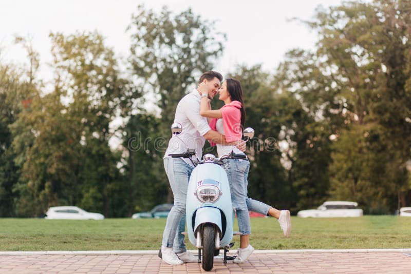 Romantic Couple Kissing, Standing Near Blue Scooter in Warm Day ...