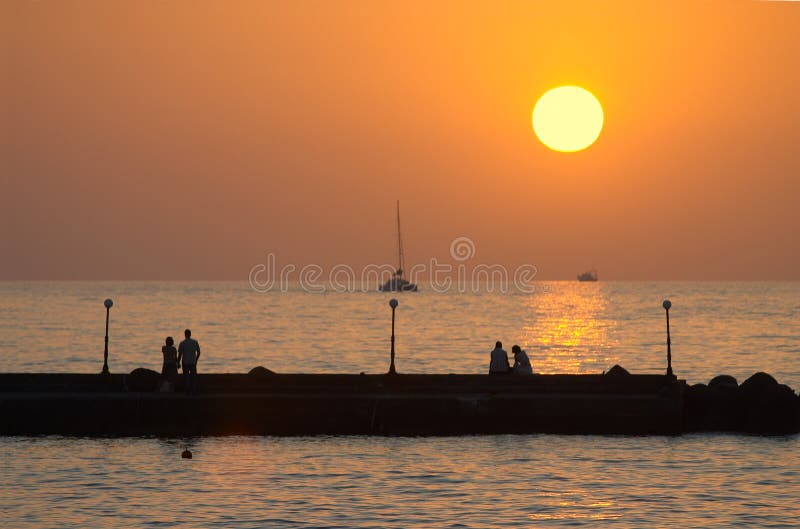 Romantic couples on a pier