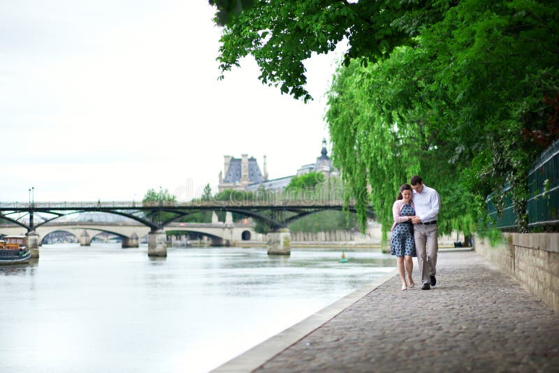Romantic dating couple walking by the water
