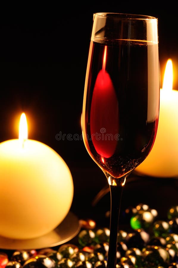 Romantic Dinner - Glass Of Red Wine And Candles Stock Image - Image of