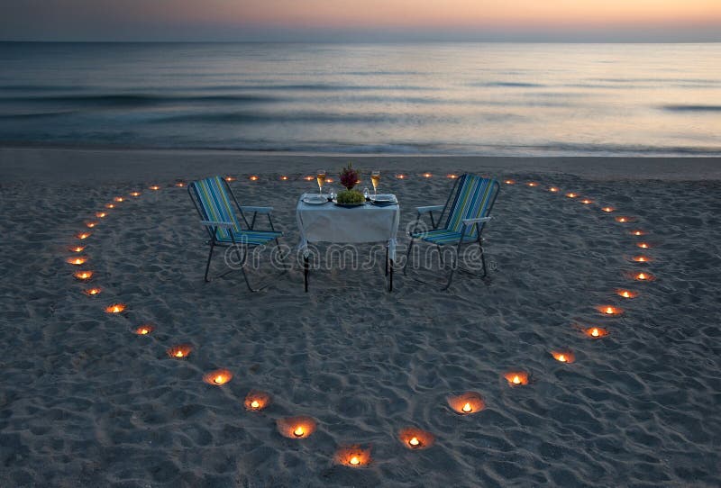 Romantic Dinner on the Sea Beach with Candle Heart Stock Photo Image