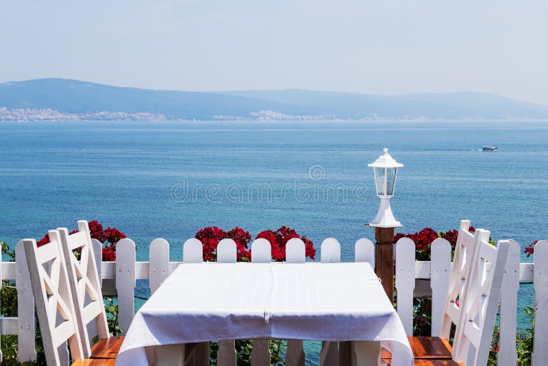 Romantic dinner by the sea stock photo. Image of dining - 138581726