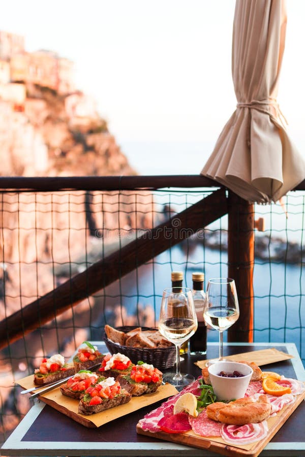 Romantic Dinner for Two at Sunset. White Wine and Tasty Italian Stock